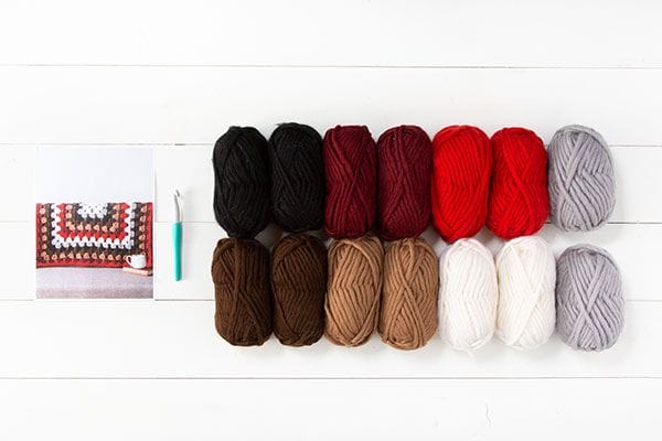 A photo of the Tuff Granny Project Kit: Includes a pattern, a hook and 14 balls of Tuff Puff yarn