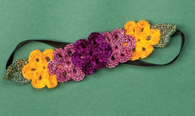 Crocheted flowers attached to an elastic headband make a great crochet flower crown