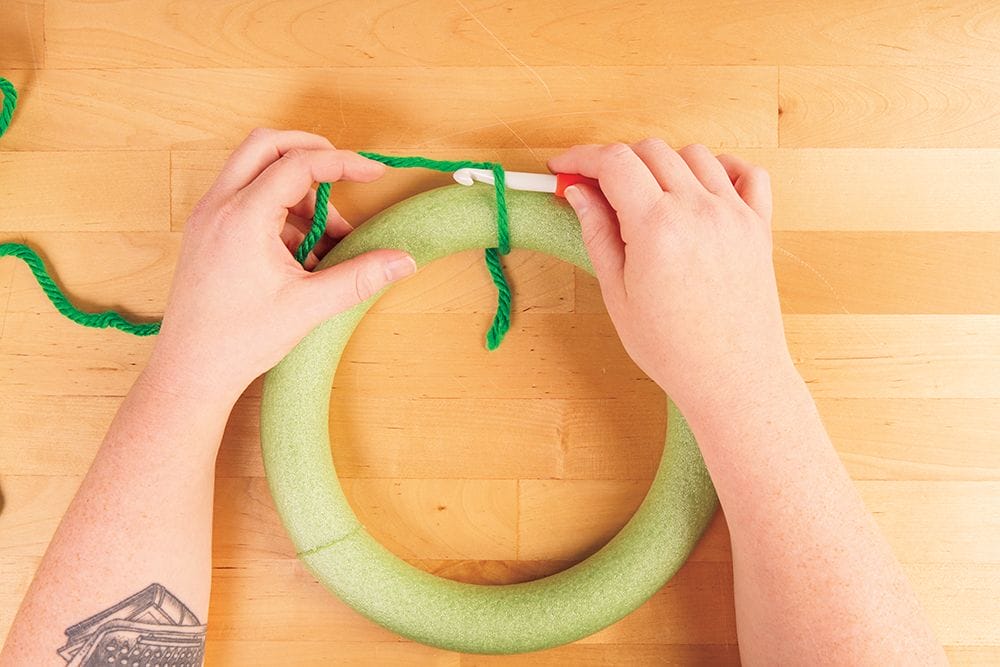 Covering a wreath form with yarn and crochet