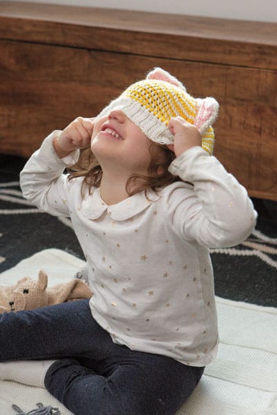 A little girl pulls a crochet hat with ...
</p>
<p>The post <a href=