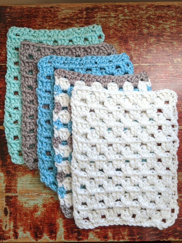 5 rectangles of crochet in the granny stitch in a range of blue and white colors