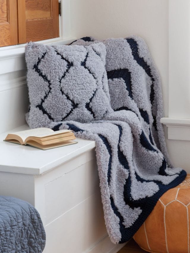 A faux fur throw and pillow