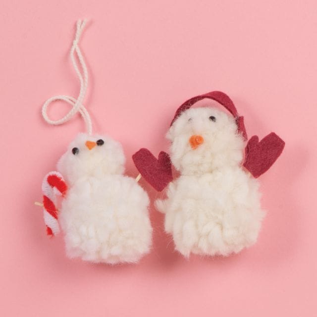Two snowman pom-pom ornaments.