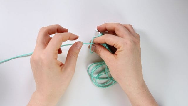 pull the single strand through end of loop to make a new long loop and allow single strand to join it as you crochet.