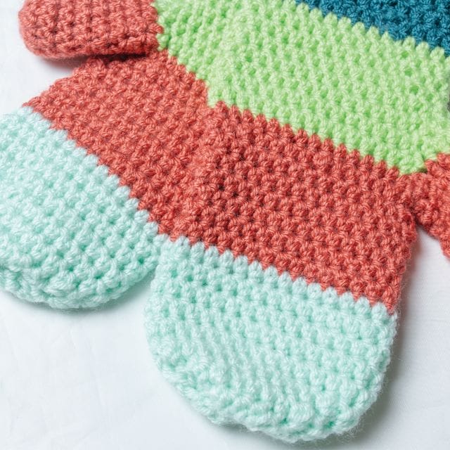Mighty Mittens: Crocheted mittens with 4 blocks of color ranging from turquoise, spring green, rust red, and mint green.