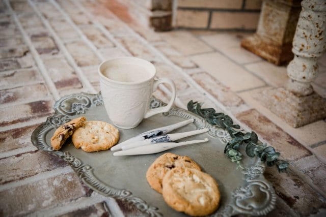 Cookies and crochet hooks on an antique tray - Crochet Foundry