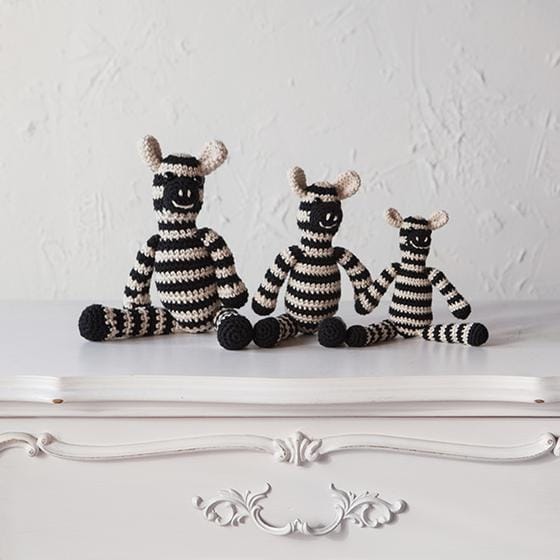 Zebra Amigurumi: 3 crocheted zebras sit next together, a small, medium, and large