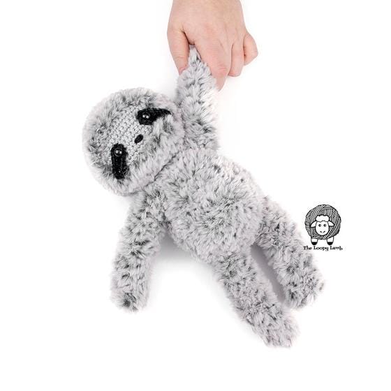 A furry gray crocheted sloth