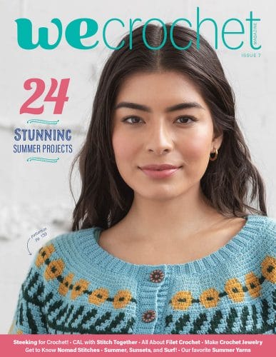 WeCrochet magazine Issue 7 cover: a woman wears a hand-crocheted sweater in turquoise with flowers surrounding the yoke in yellow and green. 