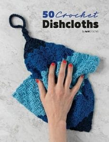 Cover of 50 Crochet Dishcloths book: Shows a hand wiping a surface with a handmade crocheted dishcloth in blue tones